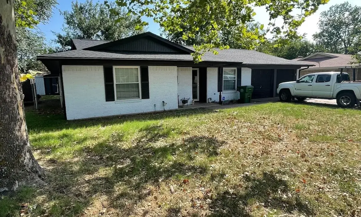 Professional roofing crew working on a residential roof in Clarksville